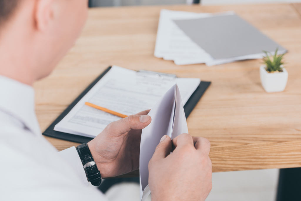 businessman opening envelope